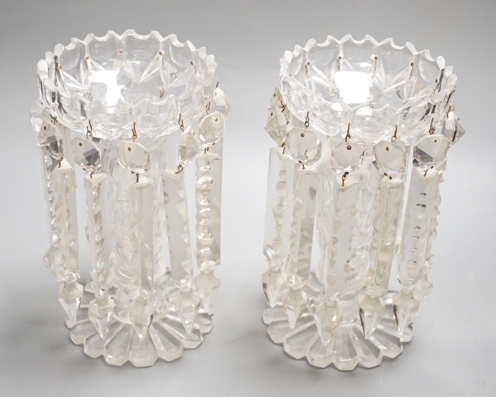 A pair of Victorian cut glass candle holders with 'spear' lustre drops (faults), 23cm high